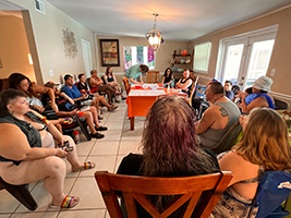 A group of people sitting in a circle.
